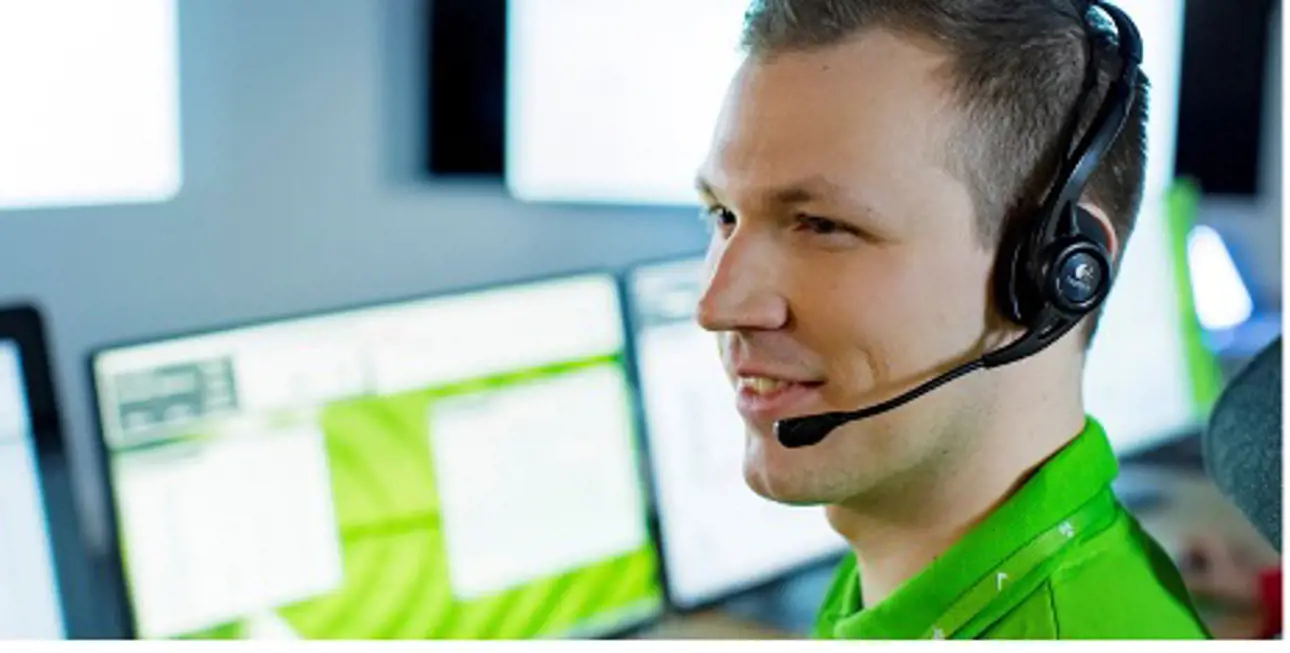 Valmet customer service professional wearing a headset and talking