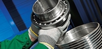 Spreader roll reconditioning and upgrades optimize performance
