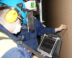 Valmet engineers take multiple ultrasonic readings of the boiler tubes.