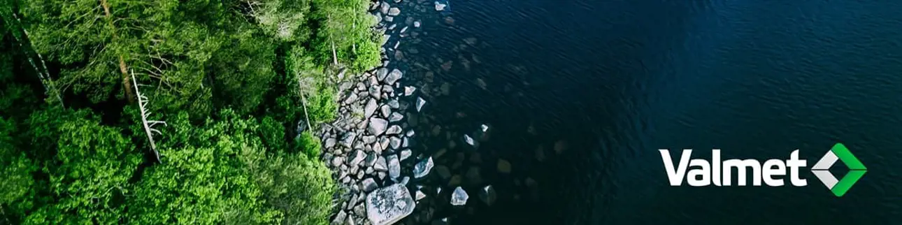 Birds eye view of lake shoreline with forest and Valmet logo