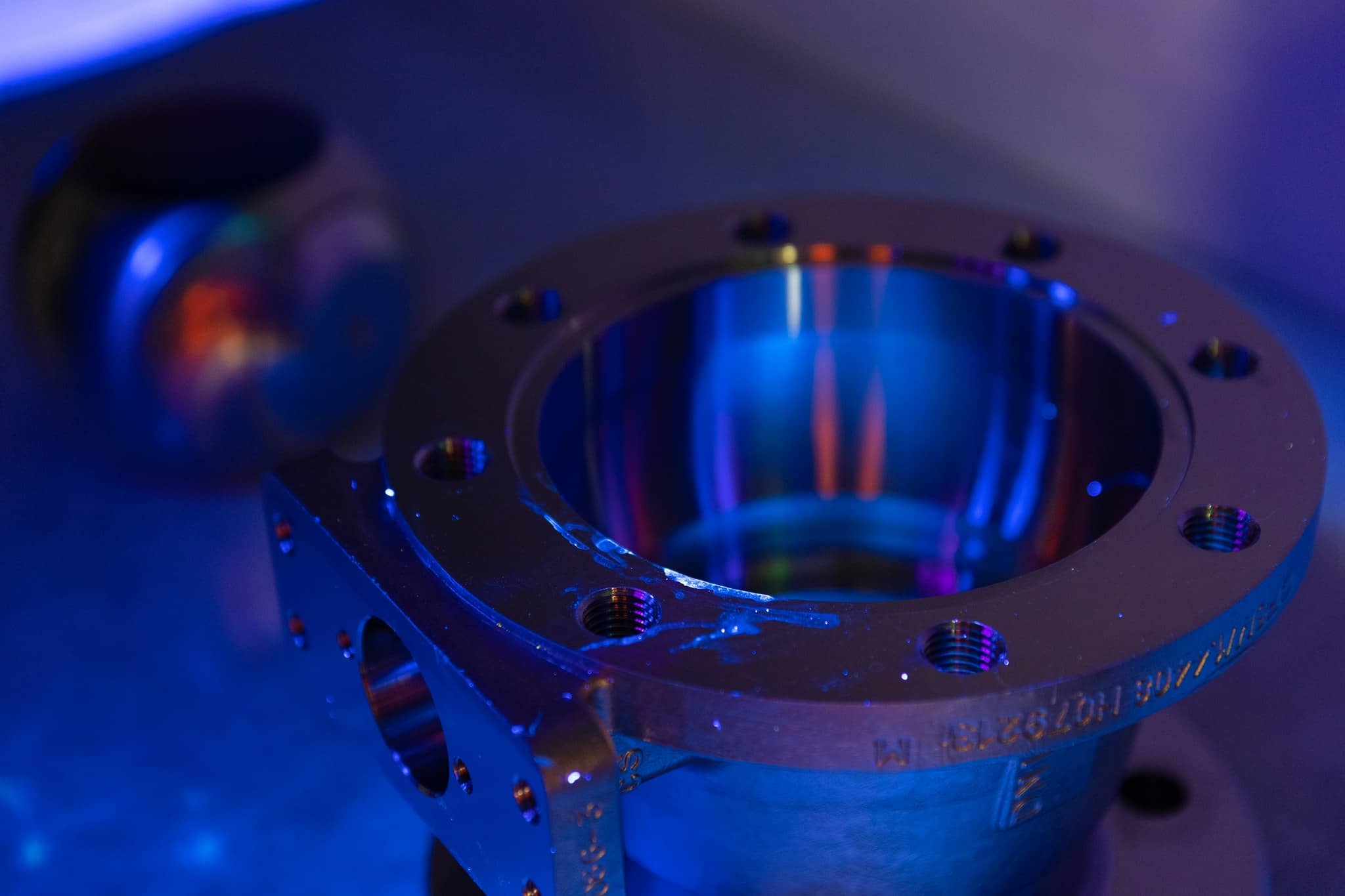 UV light inspection for cleaned valve parts