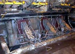 Smelt spout micro hood arrangement replaces large hood systems.