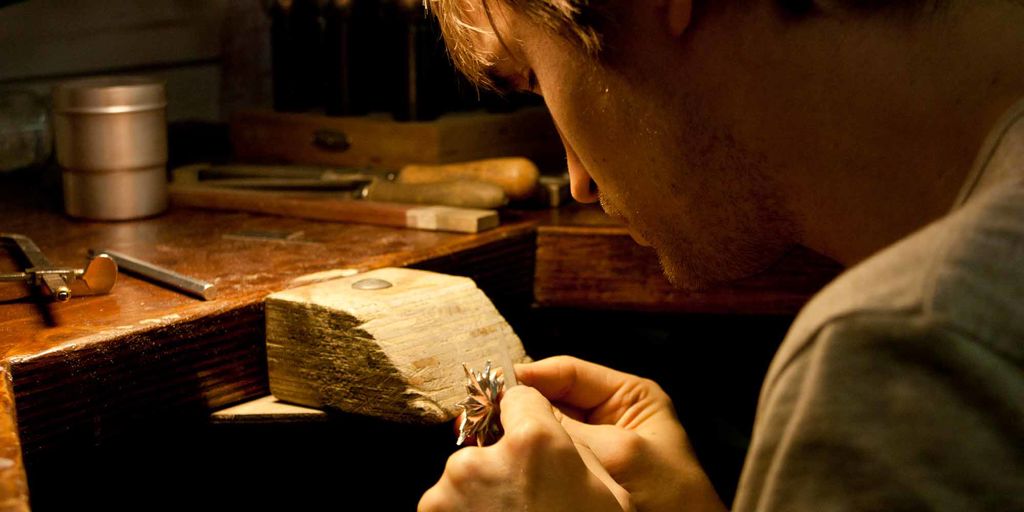 Juhani Salonen practicing his craftmanship and making a piece of jewelry in his workshop.
