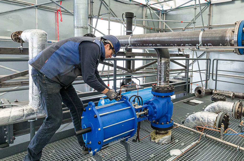 MK Technology's expert checking the control valves