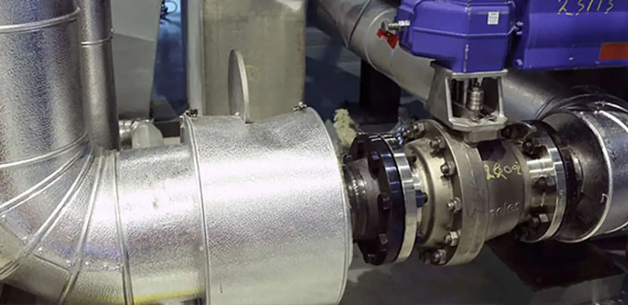 Neles ball valve installed in an industrial pipeline with actuator attached.