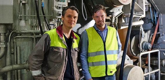 “We now save an eight-hour shutdown every six weeks,” says Pehr Mithander (left), Supervisor of BM 8 at Stora Enso Skoghall Mill. Pictured standing beside John Fridebring from Valmet.
