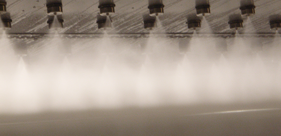 Two staggered rows of nozzles deliver a finely atomized water spray to avoid streaking.