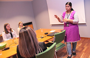 Sujatha M. discusses with summer trainees