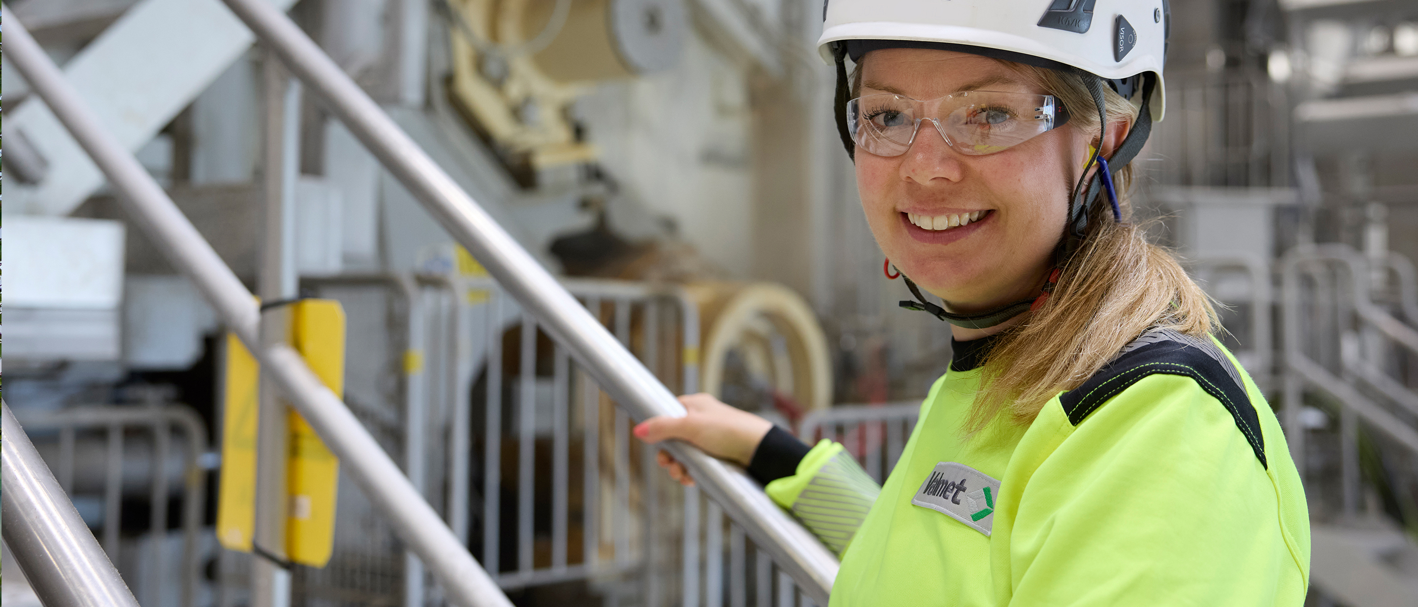 Valmet employee standing by an Advantage DCT tissue machine